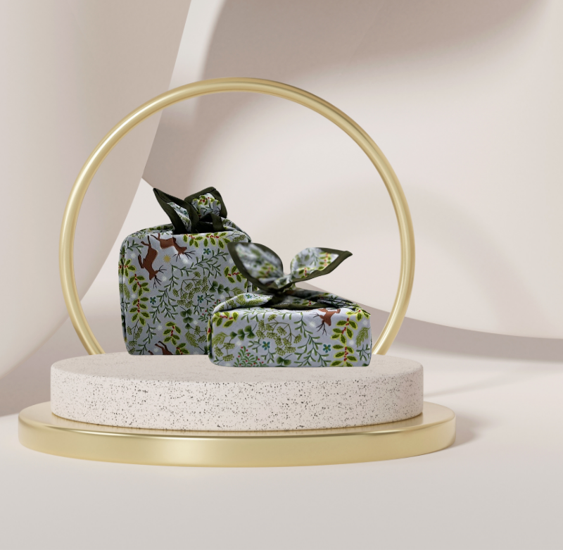 A reusable fabric gift wrap with a Christmas-themed design featuring reindeer, snowflakes, evergreen trees, and floral detail.
Luxury, eco-friendly, embroidery personalisation