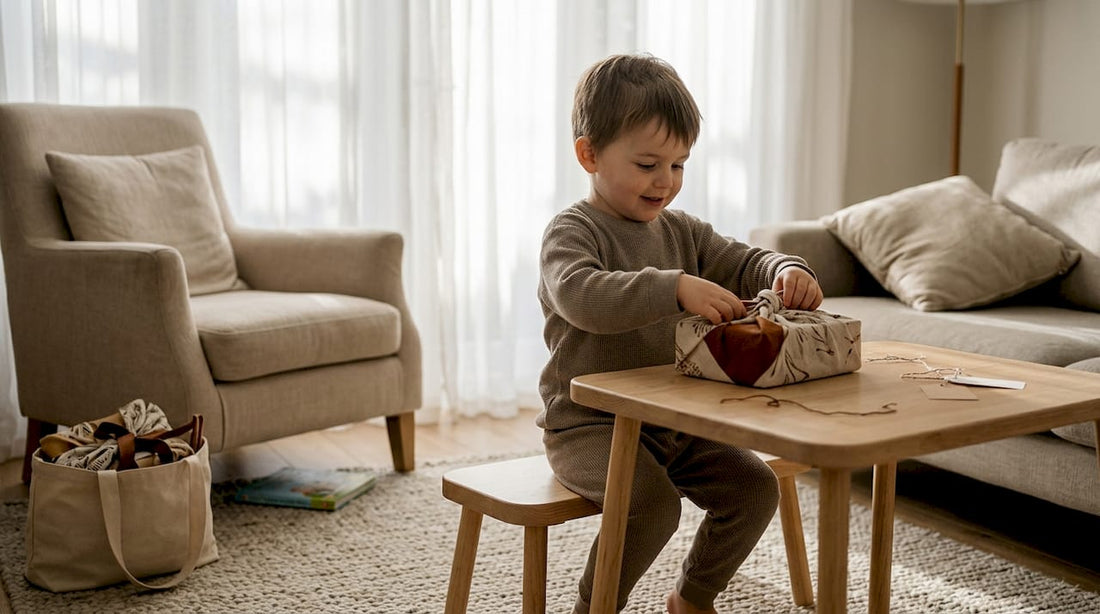 Child wrapping holiday gift with fabric wrap