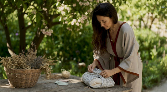 Woman wrapping eco-friendly baby gifts