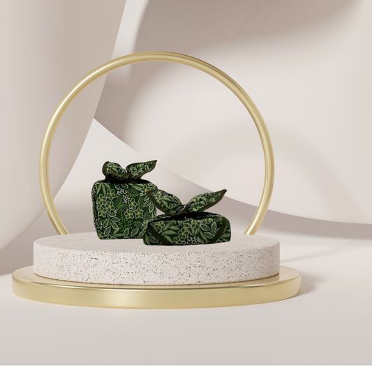 Fabric gift wrap with a winter garden theme, featuring floral patterns including evergreen leaves and berries. Luxury, eco-friendly, embroidery personalisation 