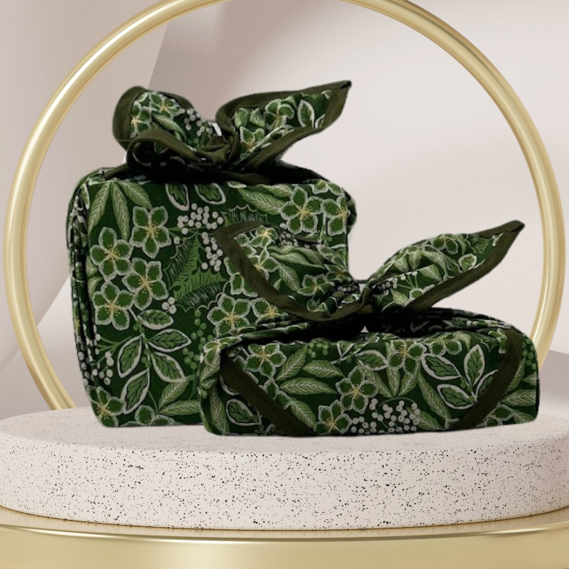 Fabric gift wrap with a winter garden theme, featuring floral patterns including evergreen leaves and berries. Luxury, eco-friendly, embroidery personalisation 