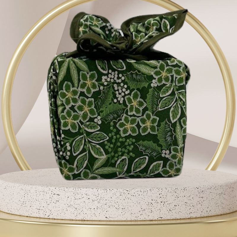 Fabric gift wrap with a winter garden theme, featuring floral patterns including evergreen leaves and berries. Luxury, eco-friendly, embroidery personalisation 