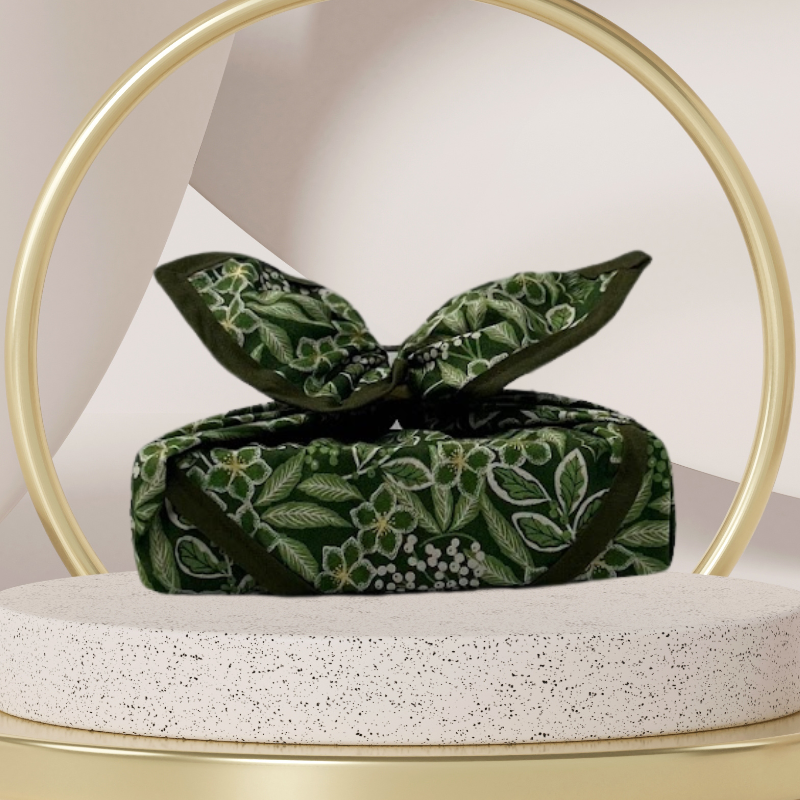 Fabric gift wrap with a winter garden theme, featuring floral patterns including evergreen leaves and berries. Luxury, eco-friendly, embroidery personalisation 