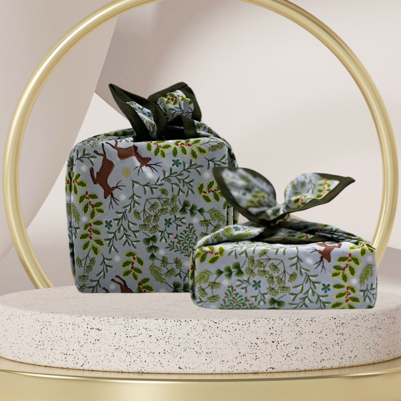 A reusable fabric gift wrap with a Christmas-themed design featuring reindeer, snowflakes, evergreen trees, and floral detail.
Luxury, eco-friendly, embroidery personalisation 