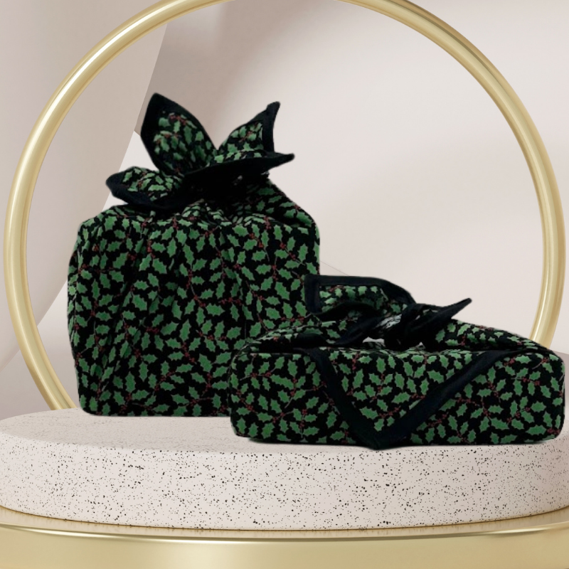 A fabric gift wrap with a Christmas holly pattern, luxury, personalised embroidery, eco friendly 