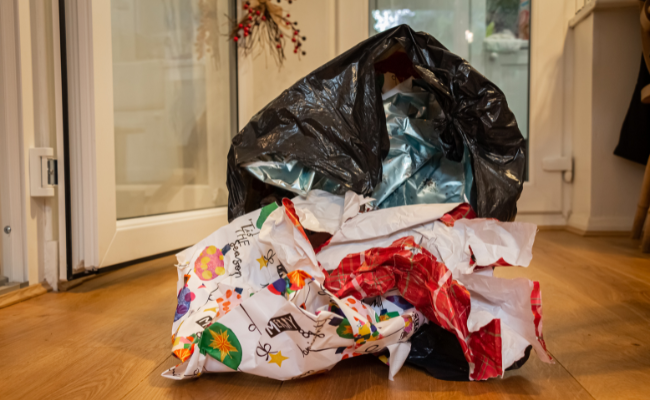 stop using wrapping paper it ends in landfill. stop the blackbin bag tradition every christmas 